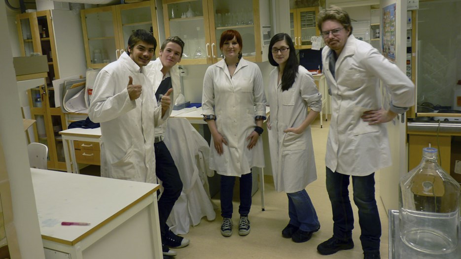 A group of students in lab coats at the Environmental Archaeology Laboratory