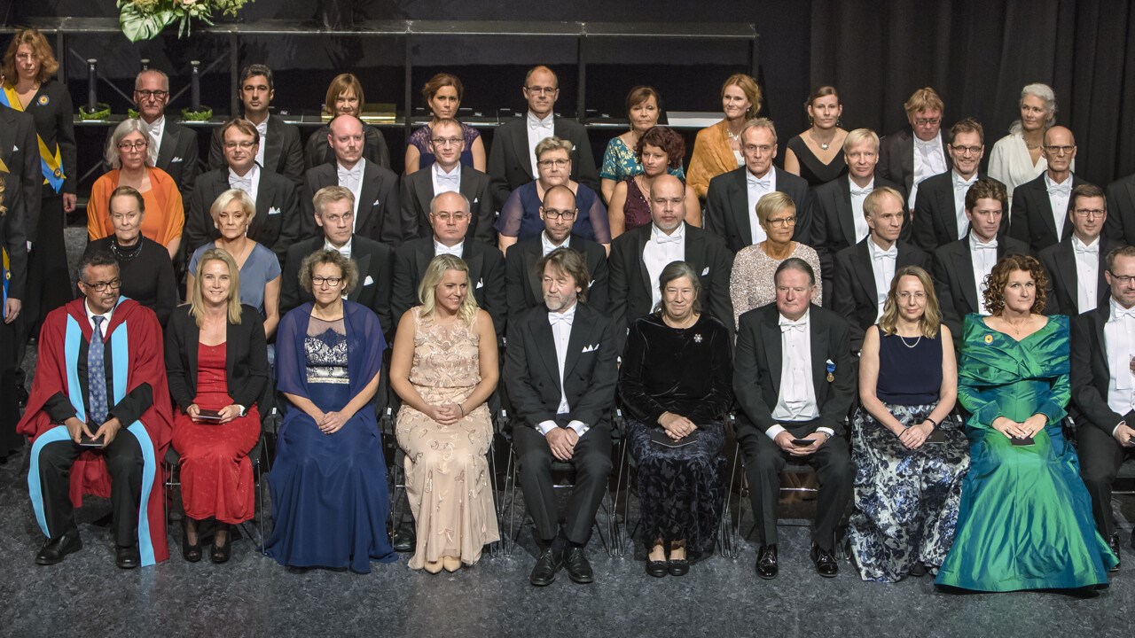 Group photo of guests of honour on stage in Aula Nordica at the 2018 Annual Celebration.