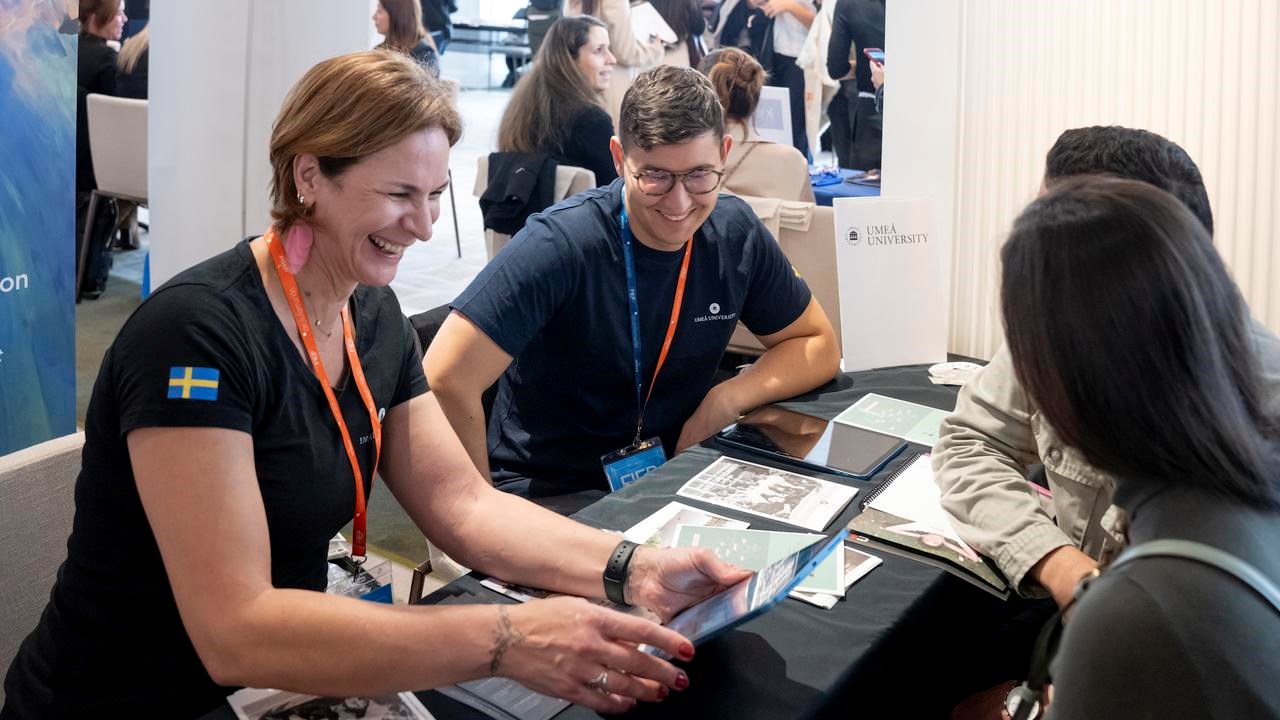 University representative talking with prospective students