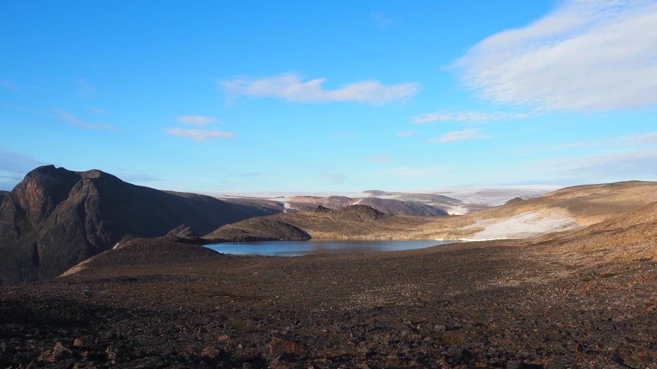 Picture of lake and surrounding barren landscape and mountains
