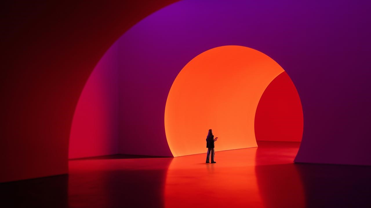 Minimalist mixed media with human figure inside abstract color tunnel.