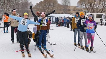 Three teams of skiers are preparing for a ski race in the "battleship" category - four skiers on one pair of skis