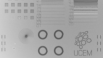 Different patterns on a surface, including a logotype of Umeå Centre for Electron Microscopy (UCEM)