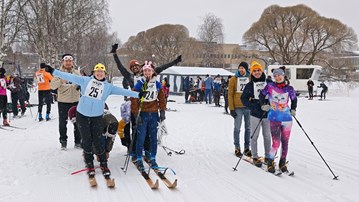 Three teams of skiers are preparing for a ski race in the "battleship" category - four skiers on one pair of skis