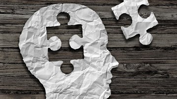 Genrebild på ett huvud i profil i papper där en pusselbit från hjärnan plockats ut och ligger bredvid. Kan illustrera sånt som har med hjärnan att göra såsom intelligens, minne eller hjärnsjukdom.