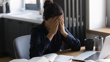 A tired and stressed woman