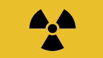 Symbol som varnar för strålning.