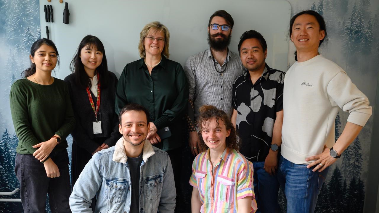 A group of people standing next to each other.