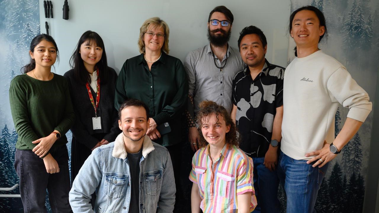 A group of people standing next to each other.