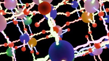 Ett gäng färgglada bollar på en svart bakgrund.