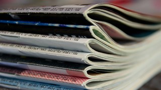 Clise up picture of a pile of journals.