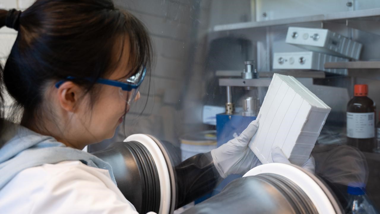 Xiaojing working with battery cells in the lab