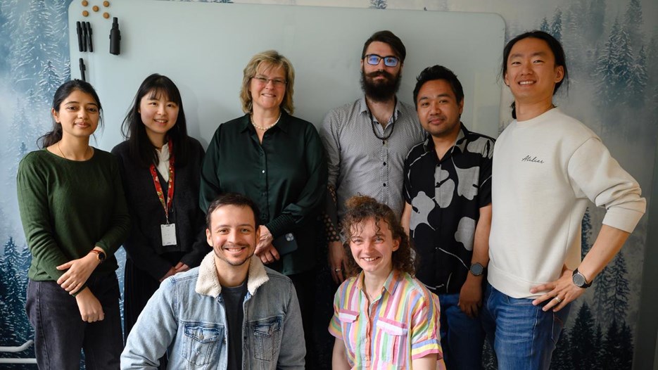 A group of people standing next to each other.