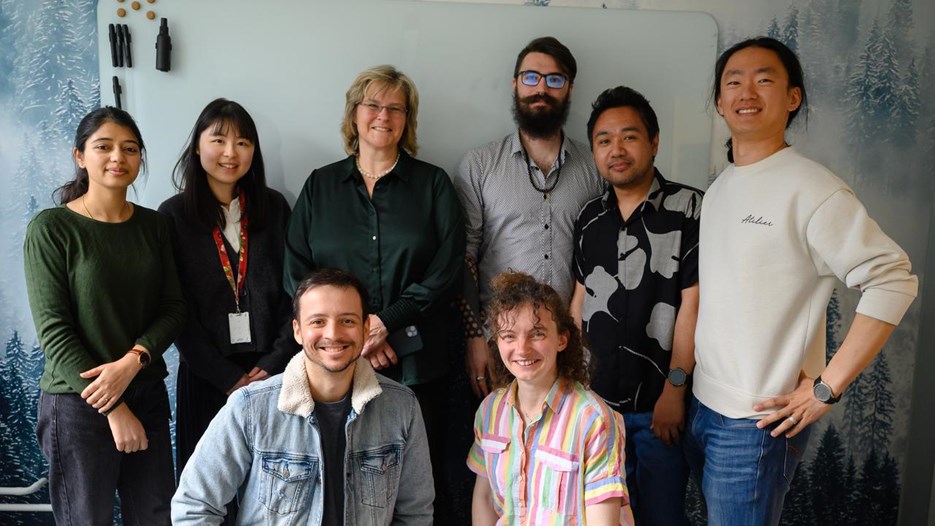 A group of people standing next to each other.