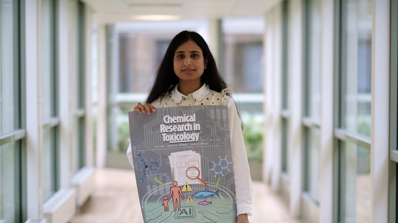 Farina holding a poster