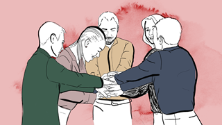 Grupp med människor som lagt sina händer på varandra