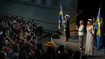 Graduation ceremony in a large auditorium