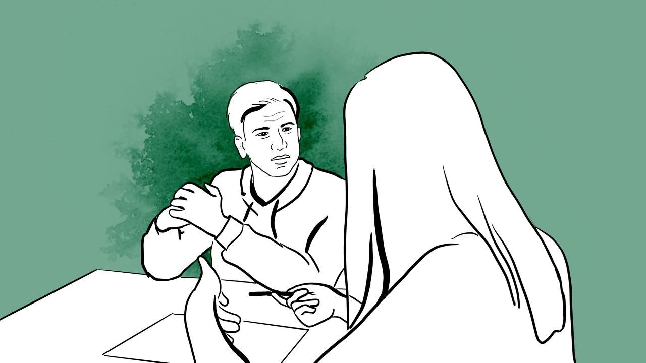 Två personer som pratar allvarligt med varandra.
