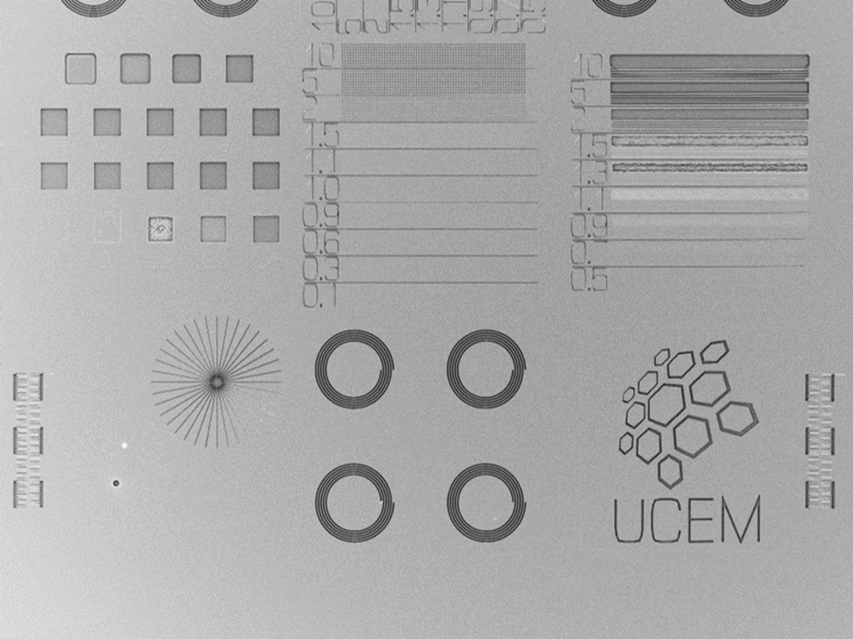 Different patterns on a surface, including a logotype of Umeå Centre for Electron Microscopy (UCEM)