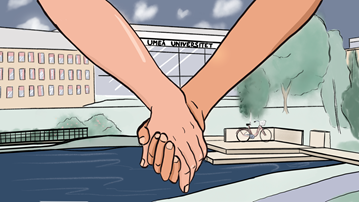 Two hands holding together in foreground in front of  Lindellhallen