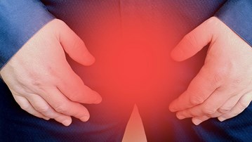 En mans skrev med röd markering. För att illustrera prostatacancer.