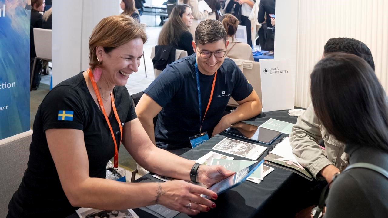University representative talking with prospective students