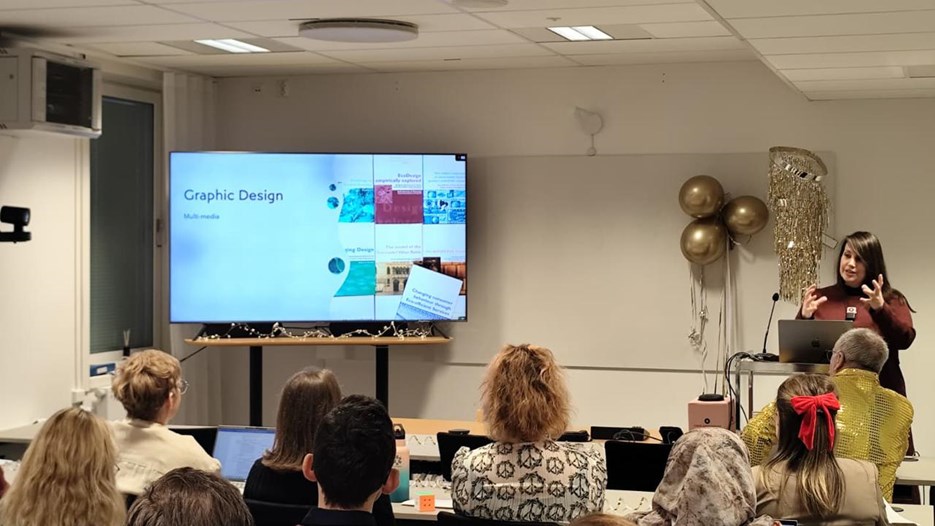 A woman giving a presentation to a group of people.