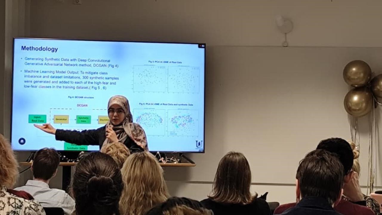 A women holding a  presentation to people