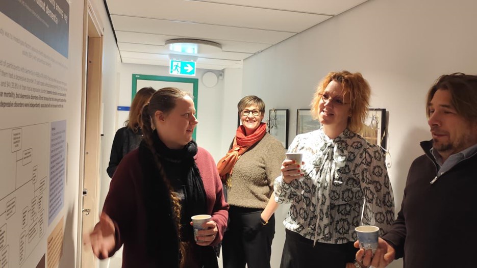 A group of people standing next to each other