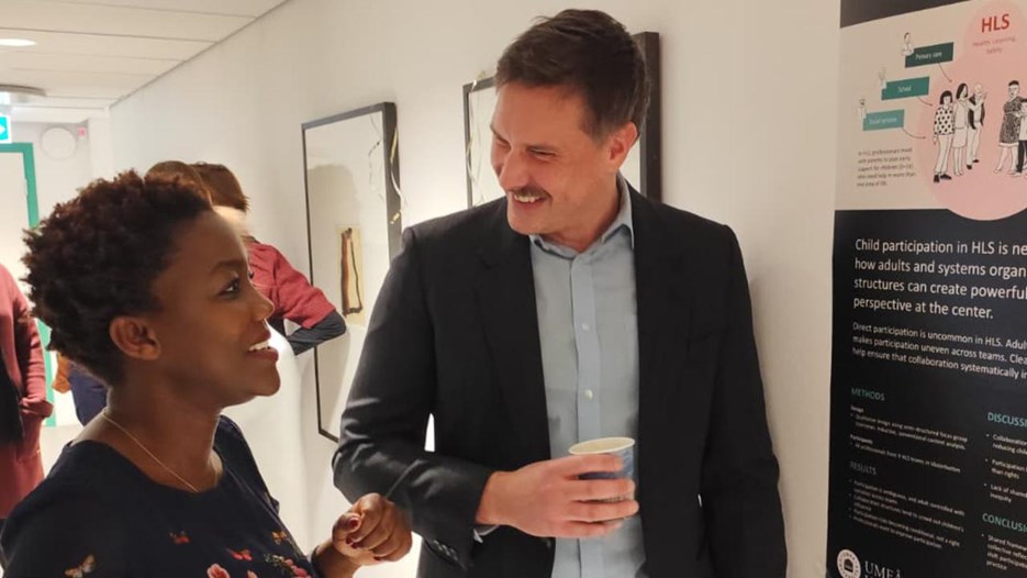 A man and a woman standing next to each other.