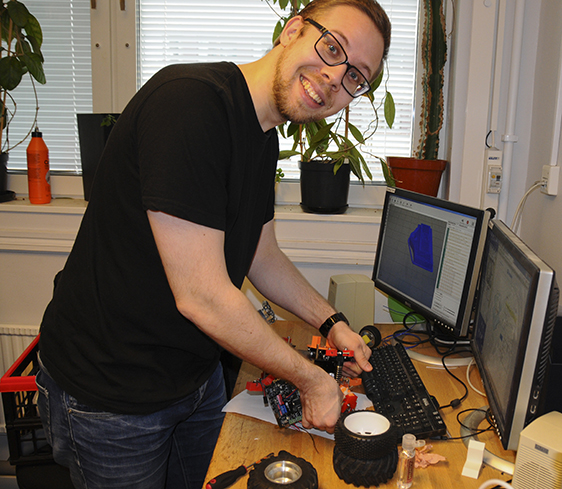 Johan Freij is attaching components on his team’s robot.