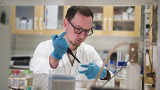 Dmytro Sokol working in a lab