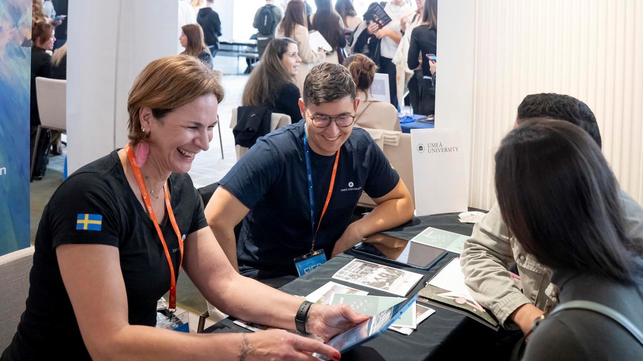 University representative talking with prospective students