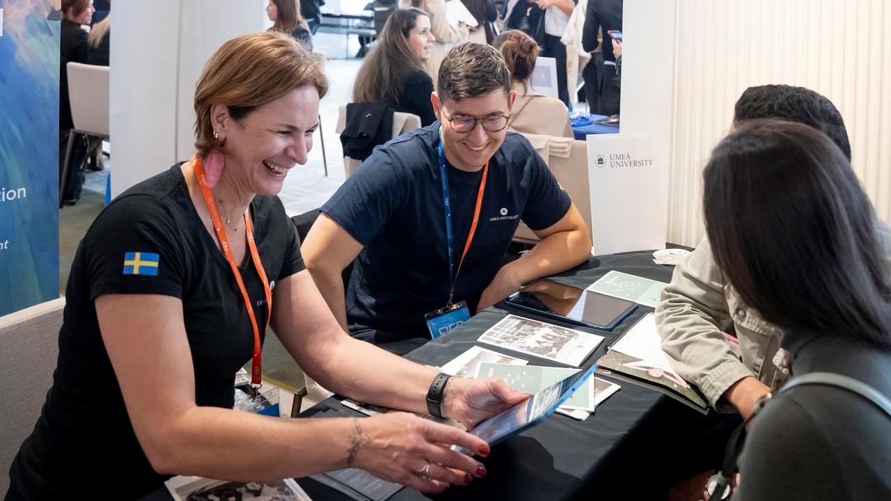 University representative talking with prospective students