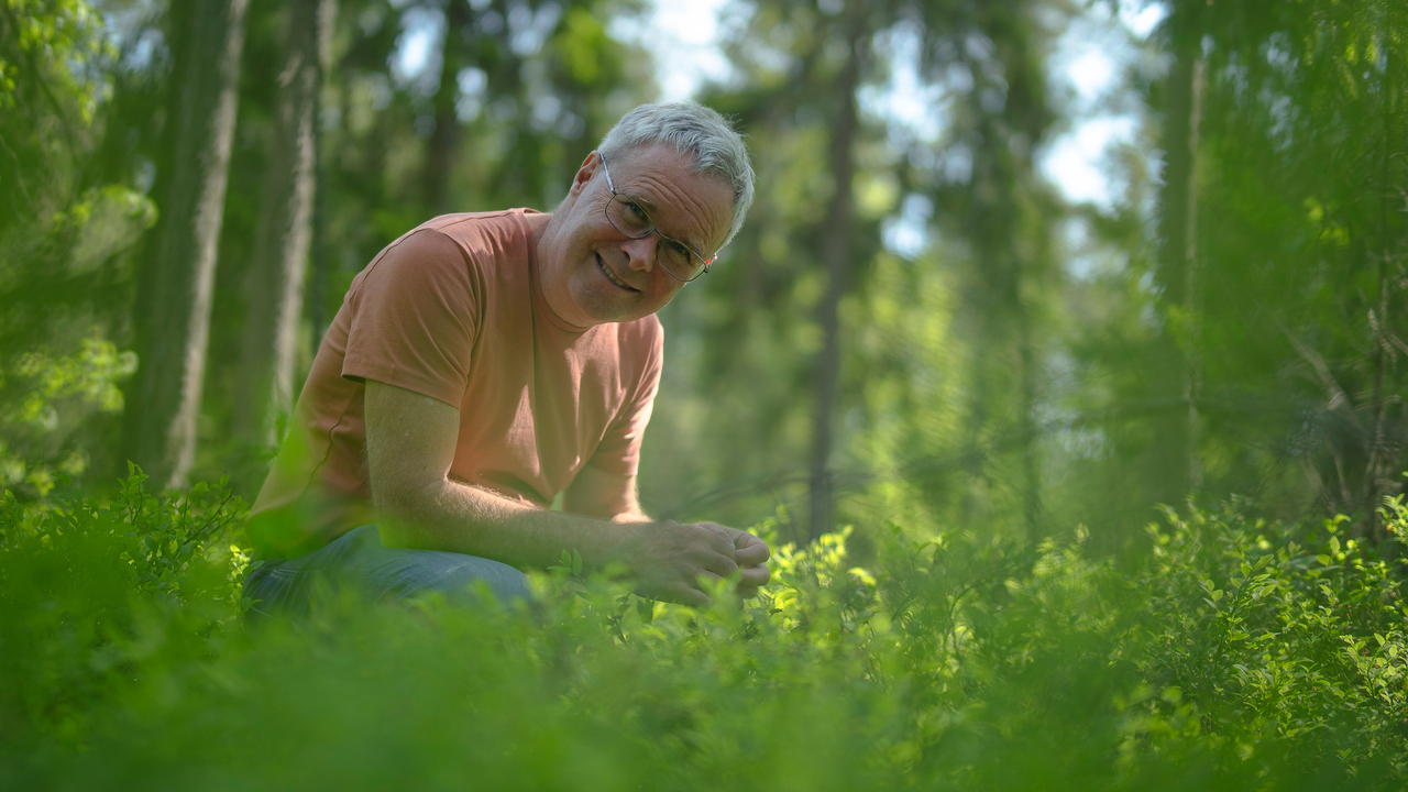 David Wardle sitting in the forest