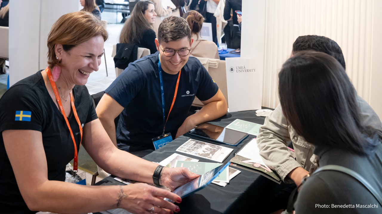 University representatives talking to prospective students