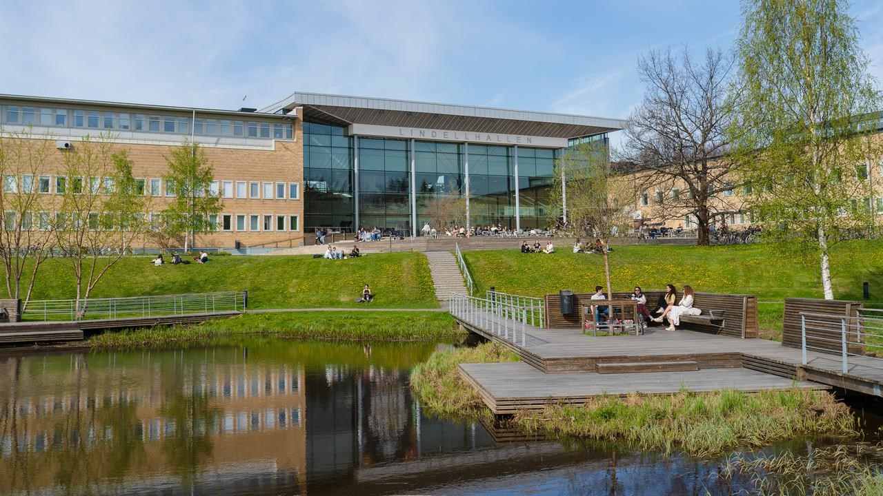 Photo of the campus area, pond and surrounding buildings