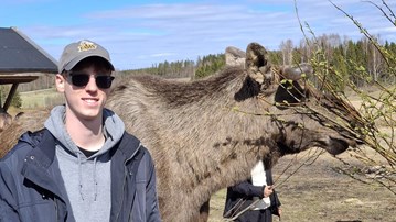 student and a moose
