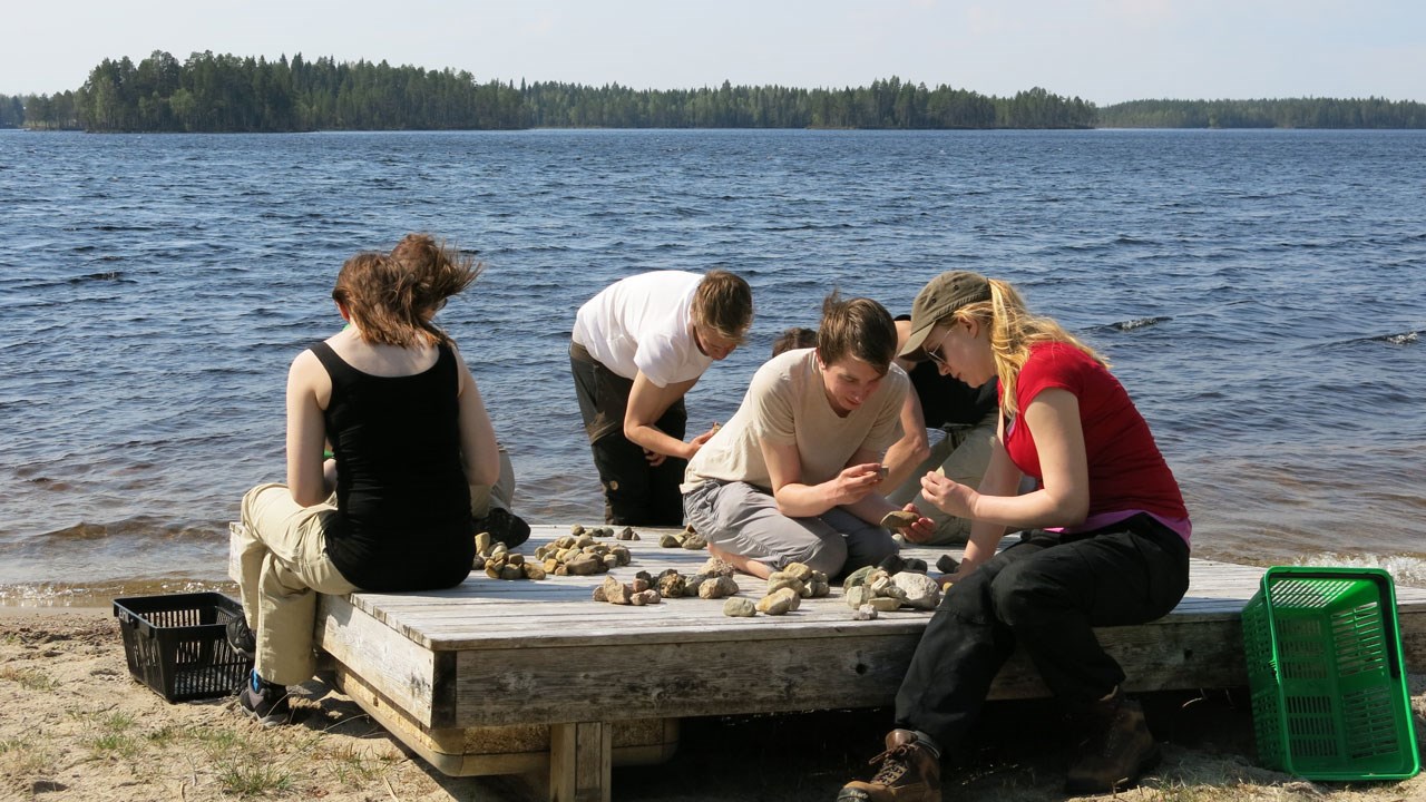 Students by a lake