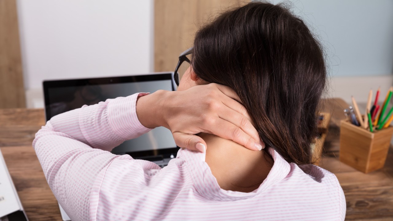 Businesswoman Having Pain In Neck