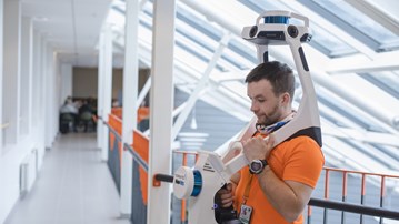 A person doing 3D scanning in the Campus Umeå premises 
