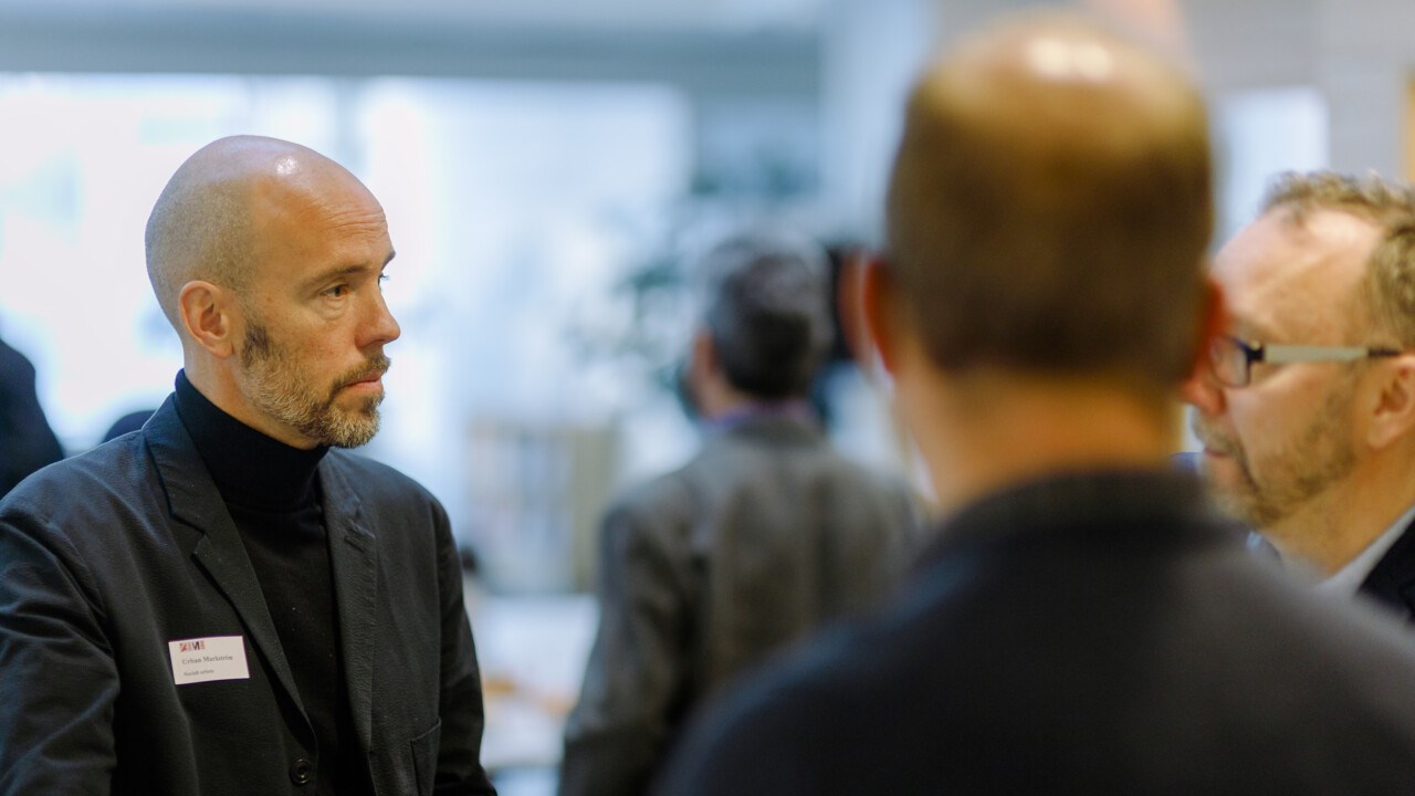 Participants in the middle of a conversation at an event.