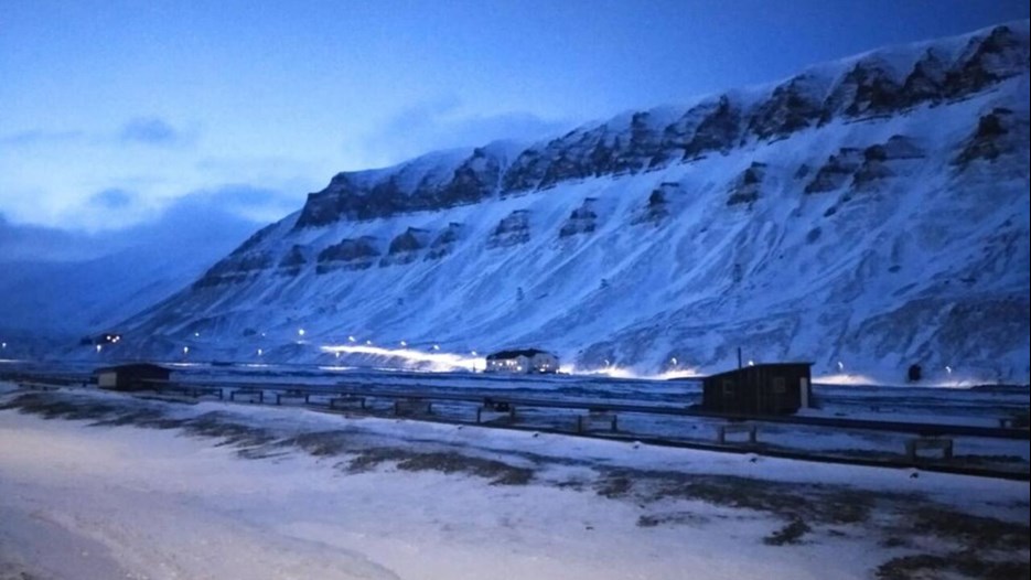 Snowy mountains in Svalbard, at dusk