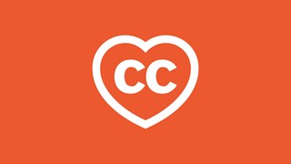 A heart with the letters CC in white on an orange-red background
