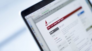 Close up of a computer with CSN page open