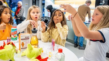 Four teens are doing experiments