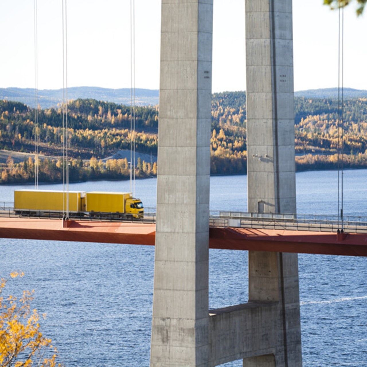 Long-truckers driving over the high coast bridge.