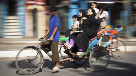 Indian family on a rickshaw. 