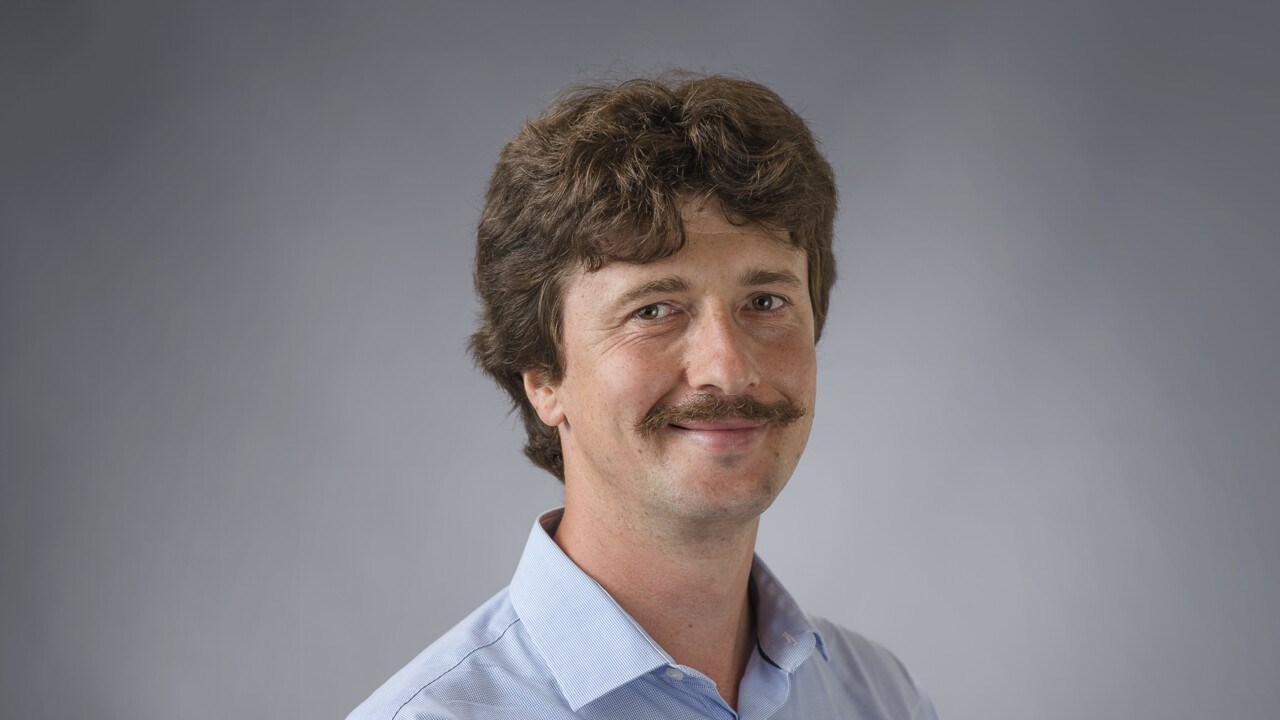 Associate Professor Roman Lakymchuk in short hair