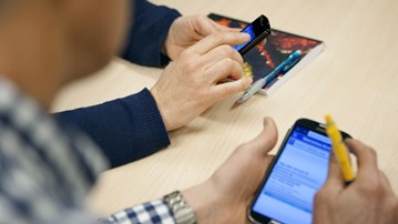 Picture of a person working on a mobile phone